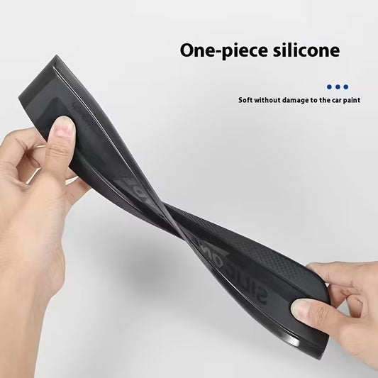 Black silicone car wrap tool held by hands with text 'One-piece Molded Silicone' and 'Soft and non damaging car paint'.